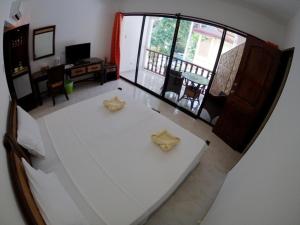 Postel nebo postele na pokoji v ubytování Alona Vida Beach Resort