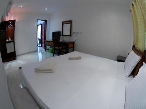 Postel nebo postele na pokoji v ubytování Alona Vida Beach Resort