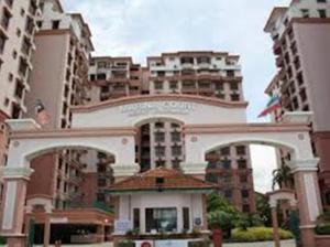 a building in front of some tall buildings at Marina Condominium Holiday Homestay in Kota Kinabalu