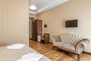 TV a/nebo společenská místnost v ubytování Ornament Hotel