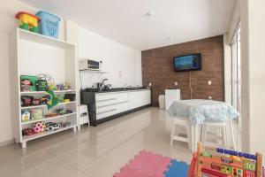 Kuchyň nebo kuchyňský kout v ubytování Ilha Norte Apart Hotel