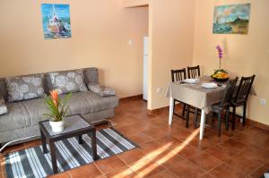 a living room with a couch and a table at Apartment Renata in Lovran