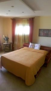 a bedroom with a large bed and a window at Albatros Sorrento in Sorrento