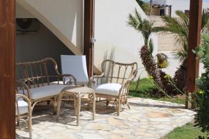 a group of chairs sitting on a patio at Boa Vista Favignana - Nuova Gestione 2026 in Favignana