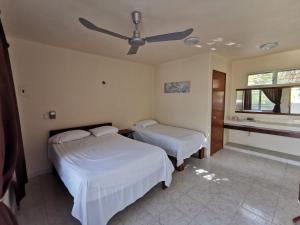 Postel nebo postele na pokoji v ubytování Las Cabañas del Doctor