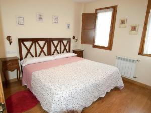 Łóżko lub łóżka w pokoju w obiekcie Apartamentos Rurales Casa Tata