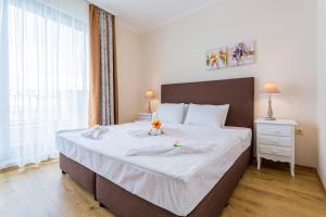 Posteľ alebo postele v izbe v ubytovaní Gardenia Beach Palace Aparthotel