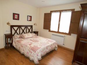 Łóżko lub łóżka w pokoju w obiekcie Apartamentos Rurales Casa Tata