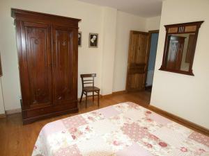 Łóżko lub łóżka w pokoju w obiekcie Apartamentos Rurales Casa Tata