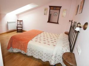 Łóżko lub łóżka w pokoju w obiekcie Apartamentos Rurales Casa Tata