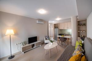 a living room with a couch and a table at La Strada Apartment in Lefkada
