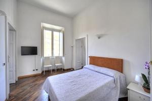 Łóżko lub łóżka w pokoju w obiekcie Rome Luxury House - The House
