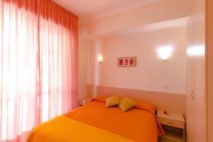 A bed or beds in a room at Casa Vacanze Isophylla