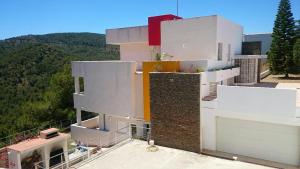 a large white building on top of a mountain at Chalet en Sierra Calderona in Valencia