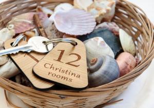 a basket filled with shells and a pair of keys at Christina Rooms in Adamantas