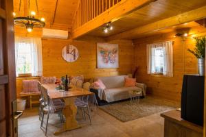 a living room with a couch and a table at Hygge Hill in Krapinske Toplice