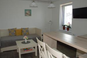 TV a/nebo společenská místnost v ubytování Apartmány Charlie