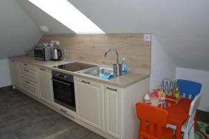 Kuchyň nebo kuchyňský kout v ubytování Apartmány Charlie