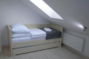 Postel nebo postele na pokoji v ubytování Apartmány Charlie