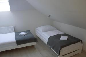 Postel nebo postele na pokoji v ubytování Apartmány Charlie