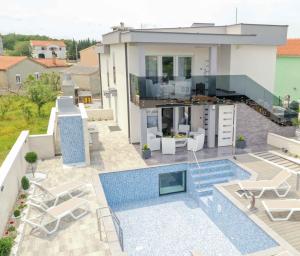 a villa with a swimming pool and a house at LUXURY VILLA BEGANOVIC-VRH in Vrh