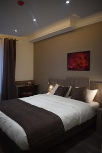 Postelja oz. postelje v sobi nastanitve Hotel Puy De Dôme