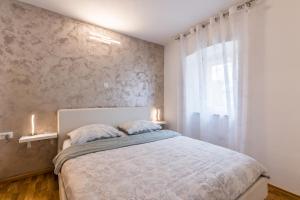 Postel nebo postele na pokoji v ubytování Apartments Vila DK