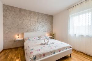 Postel nebo postele na pokoji v ubytování Apartments Vila DK