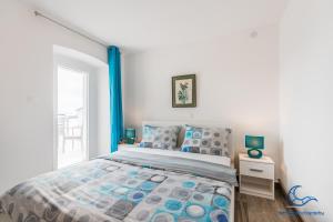 Postel nebo postele na pokoji v ubytování Apartments Vila DK