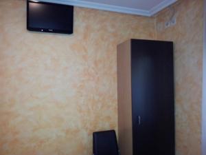 TV a/nebo společenská místnost v ubytování Alojamientos Río Cares