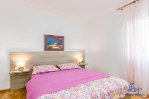 Postel nebo postele na pokoji v ubytování Apartments Vila DK