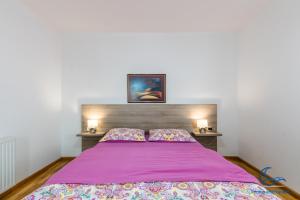 Postel nebo postele na pokoji v ubytování Apartments Vila DK
