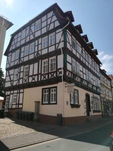 a black and white building on the corner of a street at Stadtapartment HEF in Bad Hersfeld