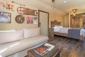 a living room with a couch and a bed at Miner's Camp in Foresthill