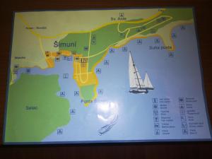 a map with a sail boat on it at Apartments Antica in Šimuni