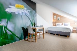 En eller flere senge i et værelse på villa botanica