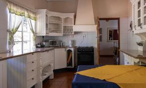 A kitchen or kitchenette at Valley Of The Rainbow Estate