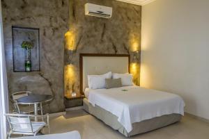 Tempat tidur dalam kamar di Hotel Virrey Cartagena
