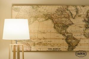 a map of the world hanging on a wall at Charming Fuencarral III - Estancias Temporales in Madrid