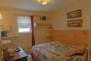 Cama o camas de una habitación en The Big Moose Inn