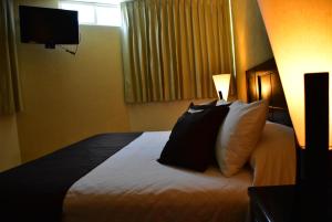 Krevet ili kreveti u jedinici u okviru objekta Hotel Suite Azomali