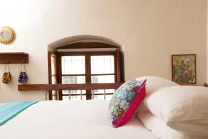 Postel nebo postele na pokoji v ubytování Casa LunaLoma - Boutique Apartments