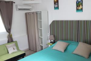 Postel nebo postele na pokoji v ubytování Résidence B&L Lagon : Bungalow Atoll + 12 fotografií