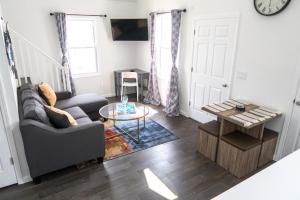 a living room with a couch and a table at Lux 3 Bd - Perfect & Parking & Massive Patio in Ventnor City