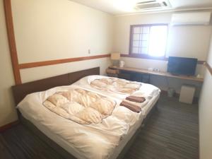 Postel nebo postele na pokoji v ubytování Hotel Nasu Otawara Hills