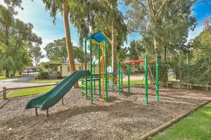 a playground with a slide in a park at Rivergardens Holiday Park Mildura in Gol Gol