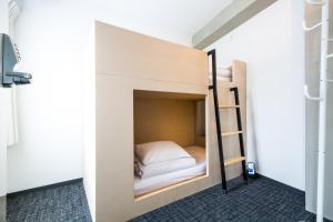 Postel nebo postele na pokoji v ubytování UNPLAN Shinjuku