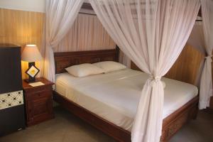 Lova arba lovos apgyvendinimo įstaigoje Nitya Home Stay Lembongan