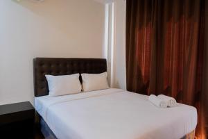 Postel nebo postele na pokoji v ubytování Comfortable Living 1BR at Asatti Apartment By Travelio + 11 fotografií