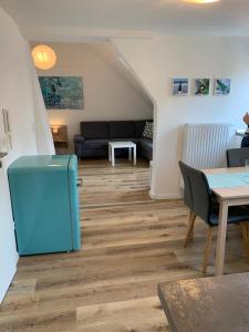 a living room with a couch and a table at Ferienhaus Moritz in Pommern